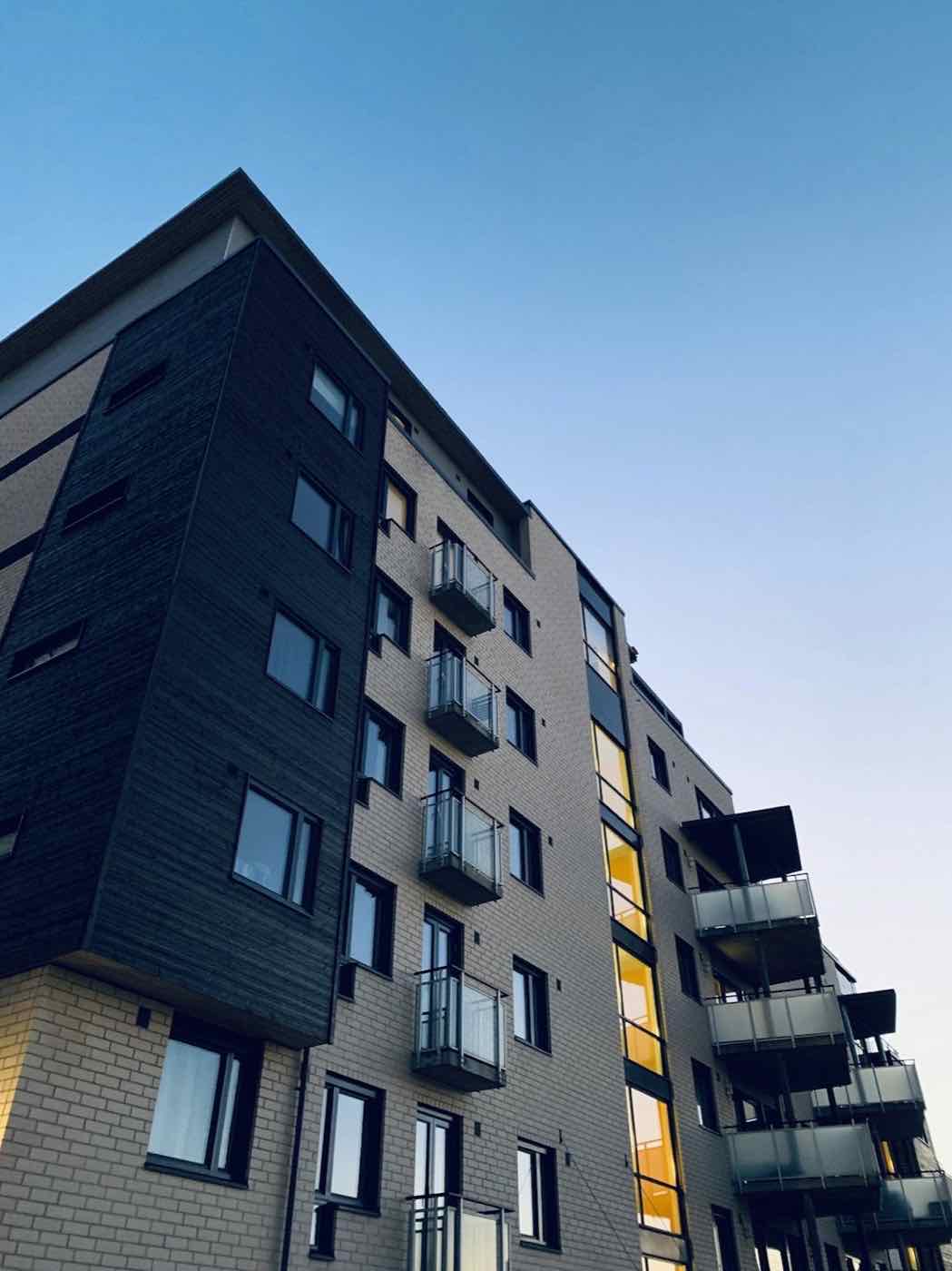 Brick multifamily building with balconies, typical of small multifamily rentals we manage in greater Baltimore.